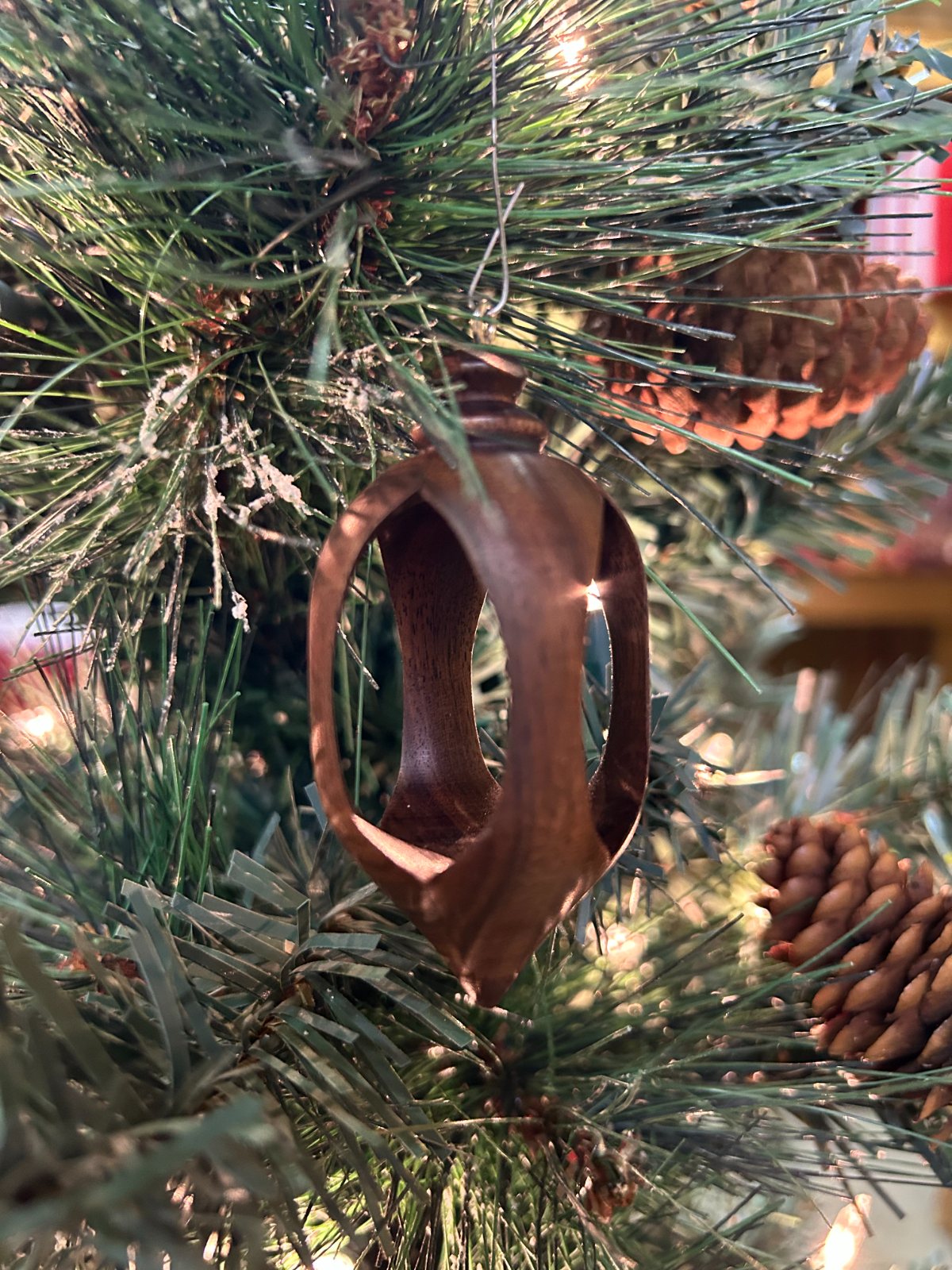 Open ornament. Another view of the open ornament among branches.