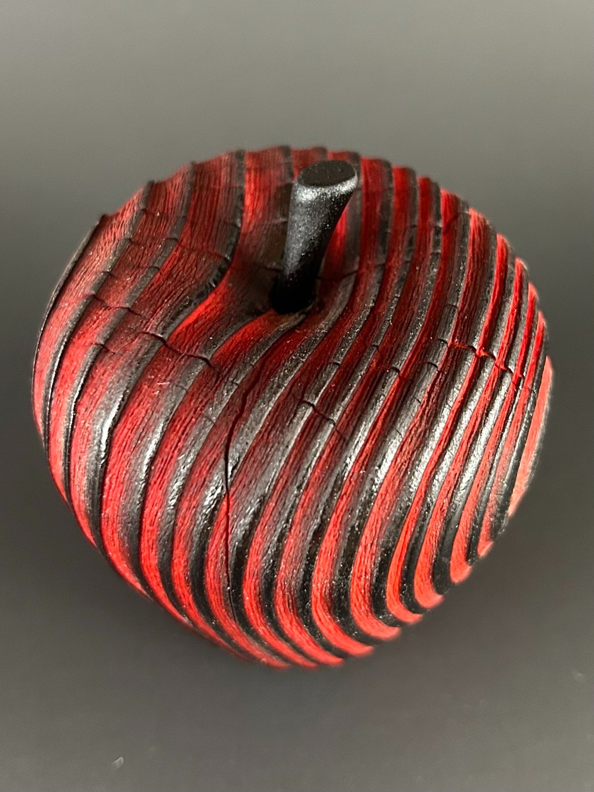 Red apple form. View of the stem and grooves from above.