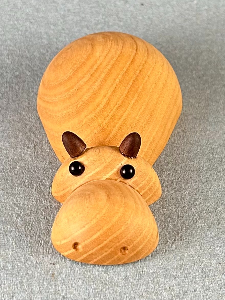 Small animal forms. Closer front view of one animal figure.