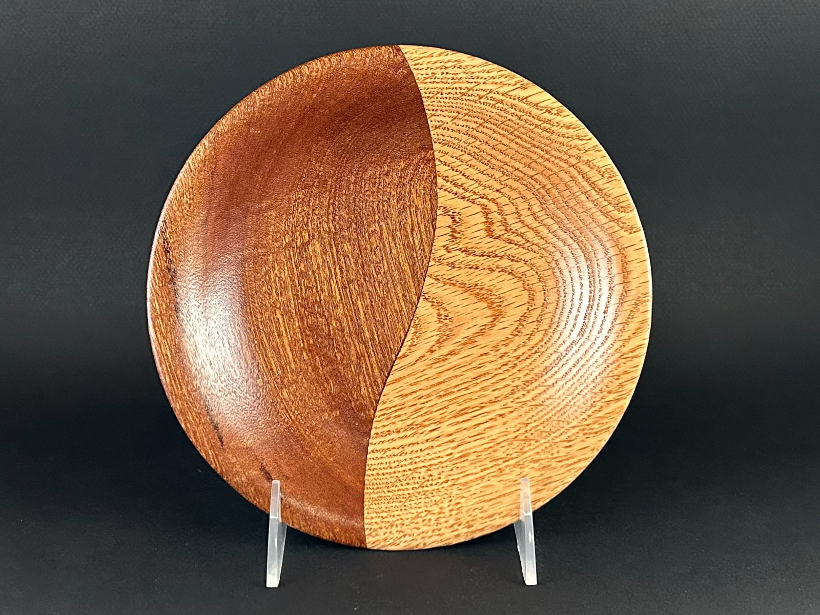Two-tone shallow dish. Shallow circular dish on a stand with a clear pale and dark division.