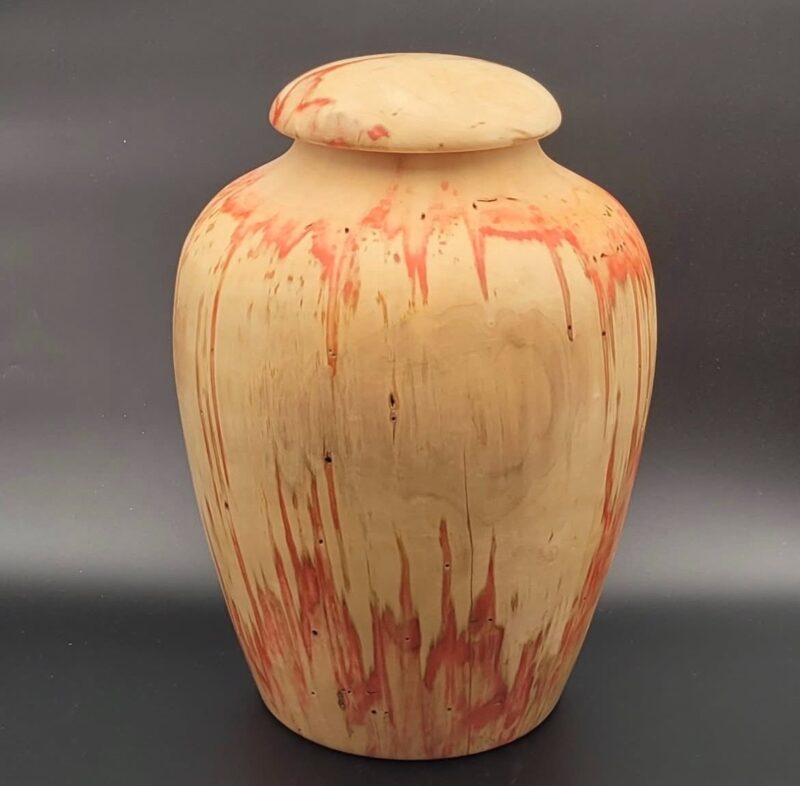 Lidded vessel. Pale lidded wooden vessel with red-toned markings.