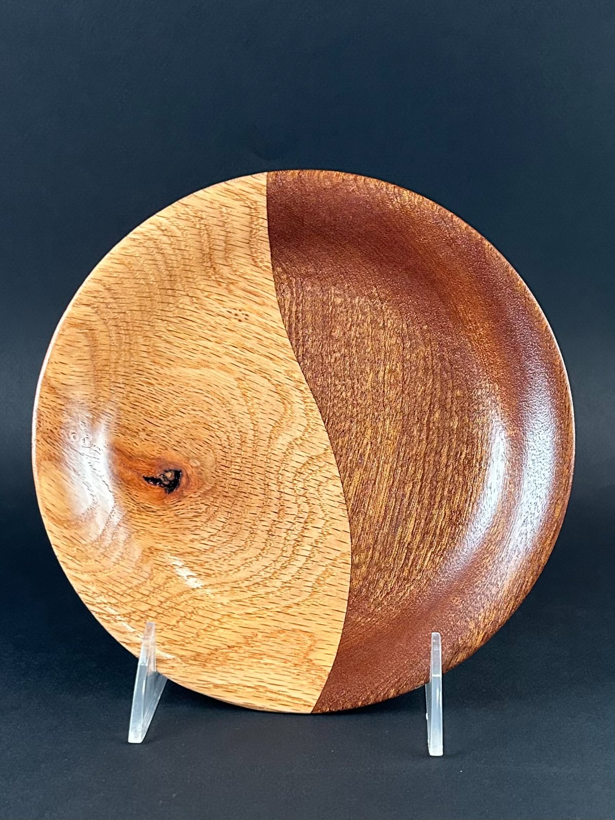 Contrasting dish pair. One of the contrasting dishes shown on a stand.